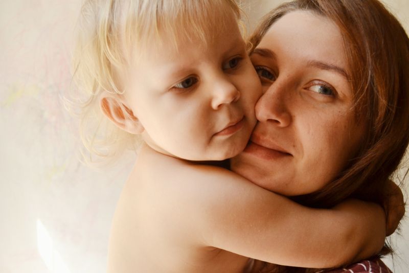 Mother holding her child close to her face